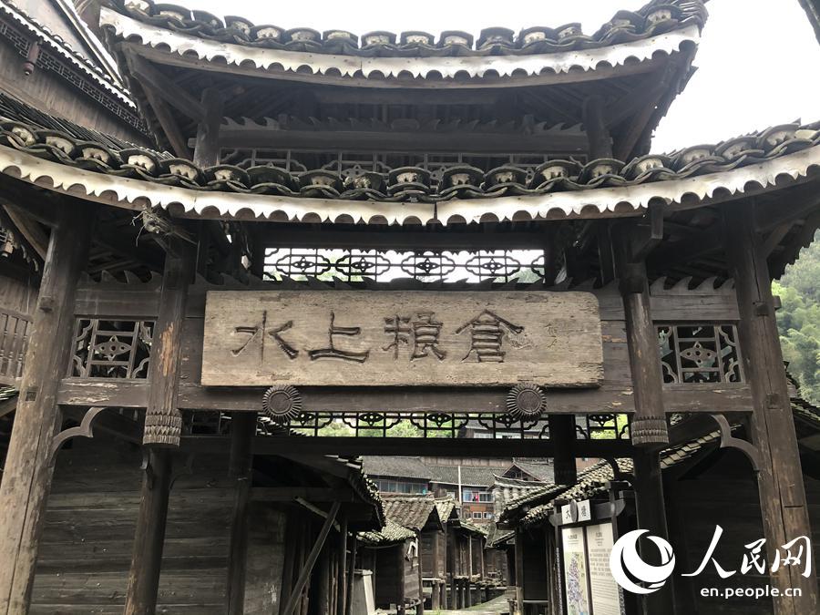 Barns built above water keep grain safe in Miao village