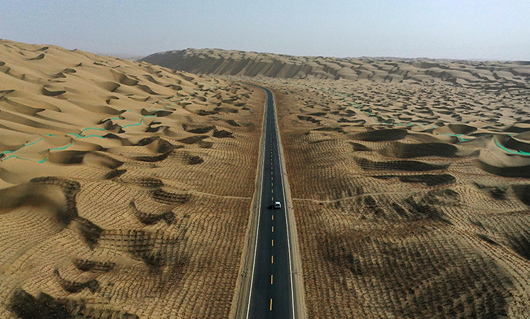 Expressway running across desert to open to traffic in China’s Xinjiang