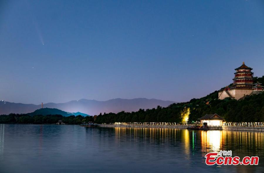 Comet streaks through night sky over Summer Palace